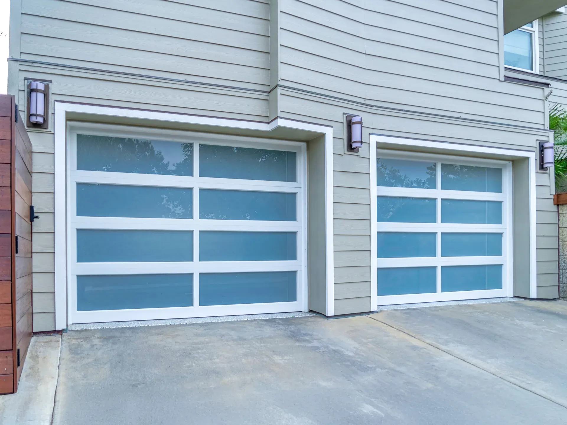 Two-car garage with white doors on a residential exterior