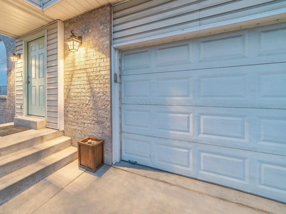 Residential garage door with a visible opener unit
